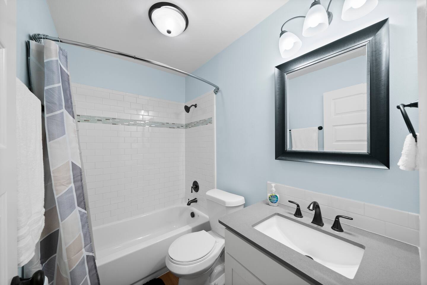 3507 Alpine Circle Austin, TX 78704 - Photo 4 of 30 a bathroom with a toilet sink a mirror a bathtub and shower