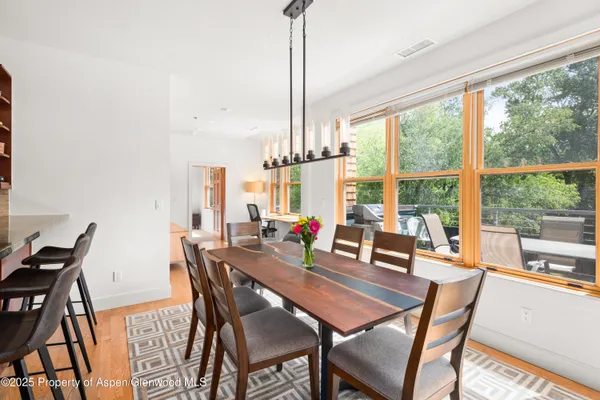 a view of a dining room with furniture window and outside view