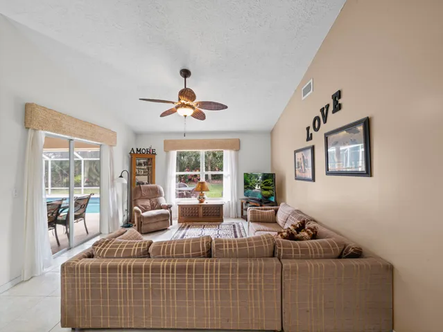 a bedroom with bed and a chandelier