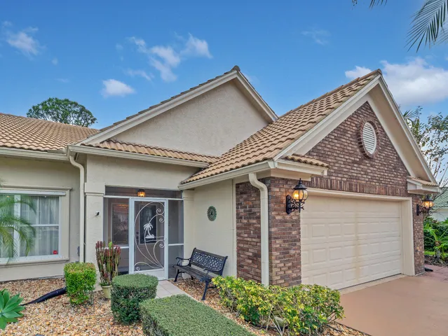an aerial view of residential house with outdoor space and swimming pool