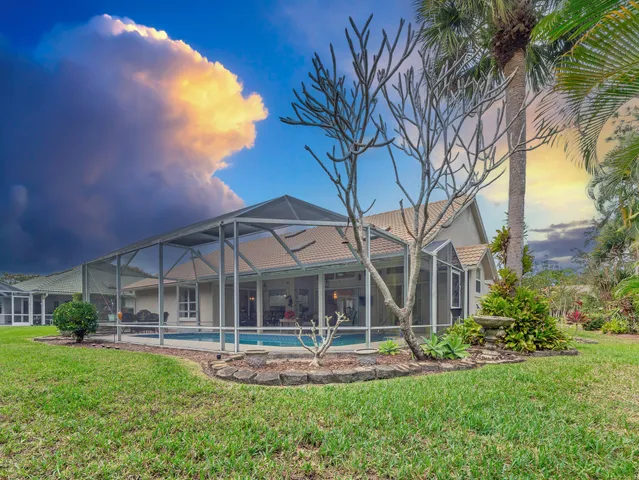 a street sign on a sidewalk next to a road