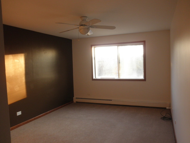 4731 St Joseph Creek Road, Unit 3G Lisle, IL 60532 - Photo 7 of 12 an empty room with a window