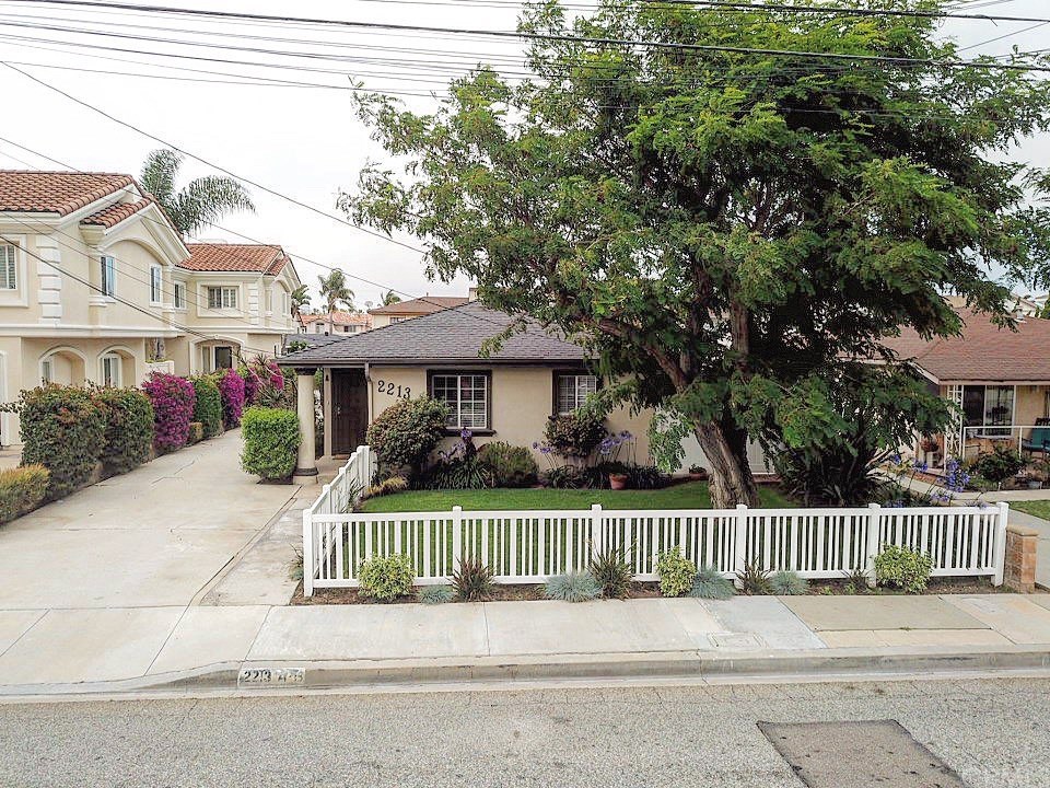 2213 Bataan Road, Unit A Redondo Beach, CA 90278 - Photo 2 of 38 One car parking space in front by picked fence.