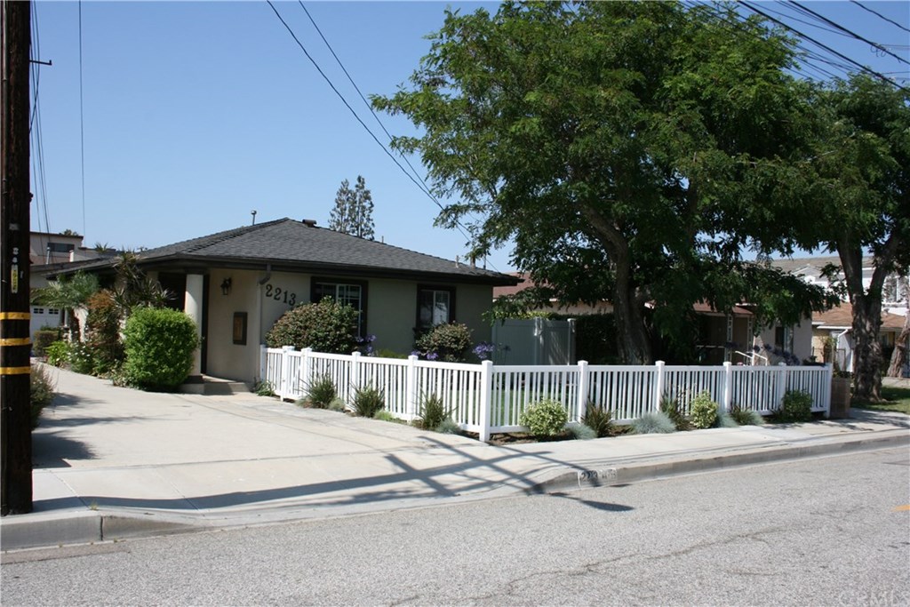 2213 Bataan Road, Unit A Redondo Beach, CA 90278 - Photo 4 of 38 1 parking spot next to picket fence.