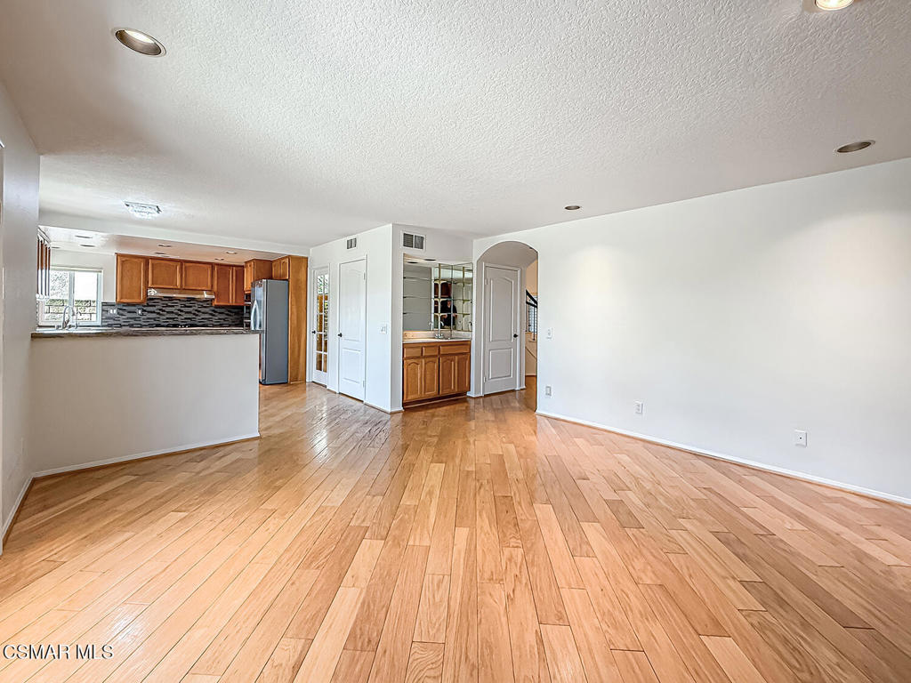 12057 Falcon Crest Way Porter Ranch, CA 91326 - Photo 13 of 86 a view of a kitchen with wooden floor and a sink