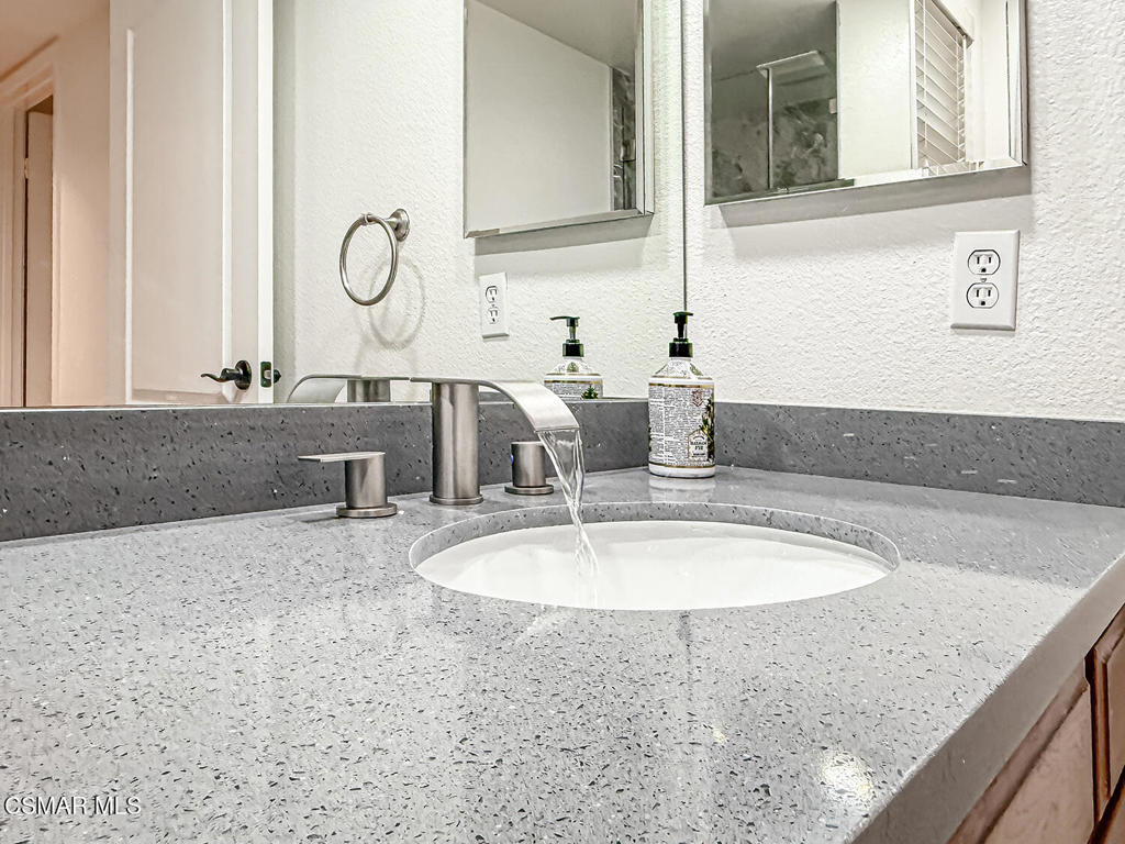 12057 Falcon Crest Way Porter Ranch, CA 91326 - Photo 26 of 86 a bathroom with sinks granite countertop a sink and a mirror