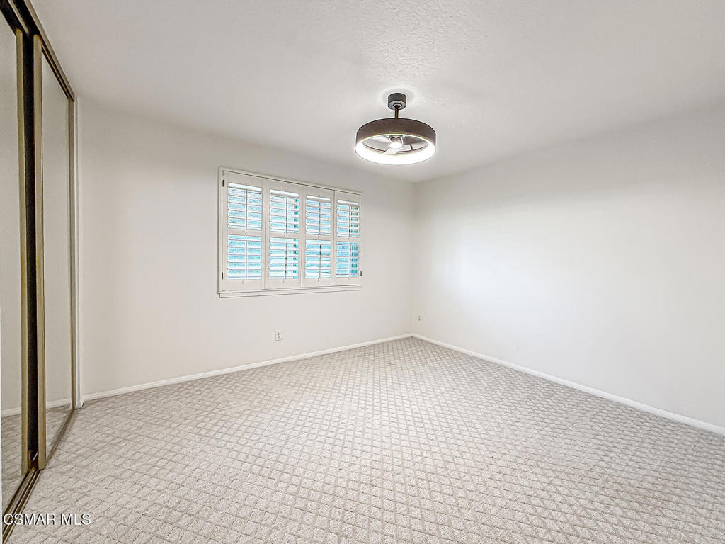 12057 Falcon Crest Way Porter Ranch, CA 91326 - Photo 33 of 86 wooden floor in an empty room with a window