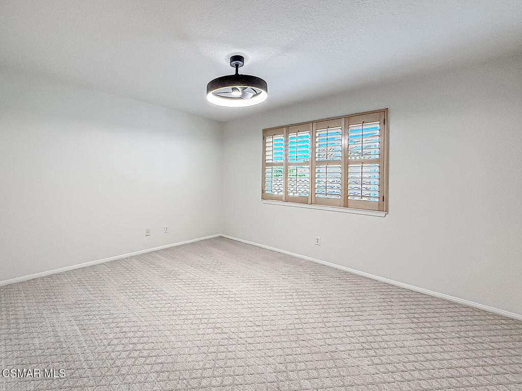 12057 Falcon Crest Way Porter Ranch, CA 91326 - Photo 35 of 86 wooden floor in an empty room with a window