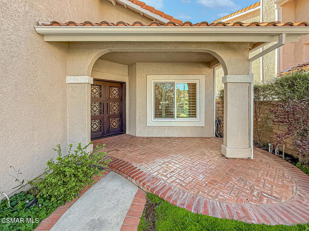 12057 Falcon Crest Way Porter Ranch, CA 91326 - Photo 4 of 86 a view of front door of a house