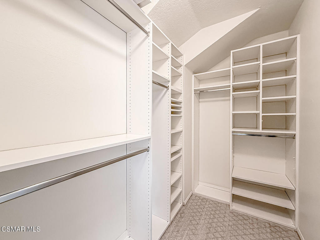 12057 Falcon Crest Way Porter Ranch, CA 91326 - Photo 49 of 86 a view of walk in closet with empty racks