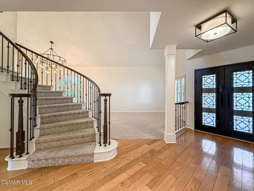 12057 Falcon Crest Way Porter Ranch, CA 91326 - Photo 6 of 86 a view of an entryway with wooden floor and door