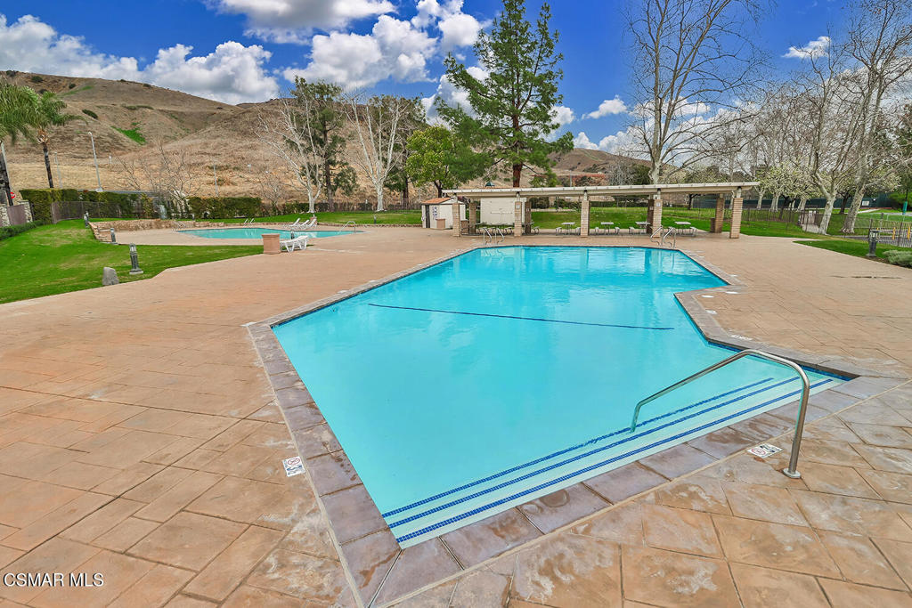 12057 Falcon Crest Way Porter Ranch, CA 91326 - Photo 67 of 86 a view of a tennis ground with large trees