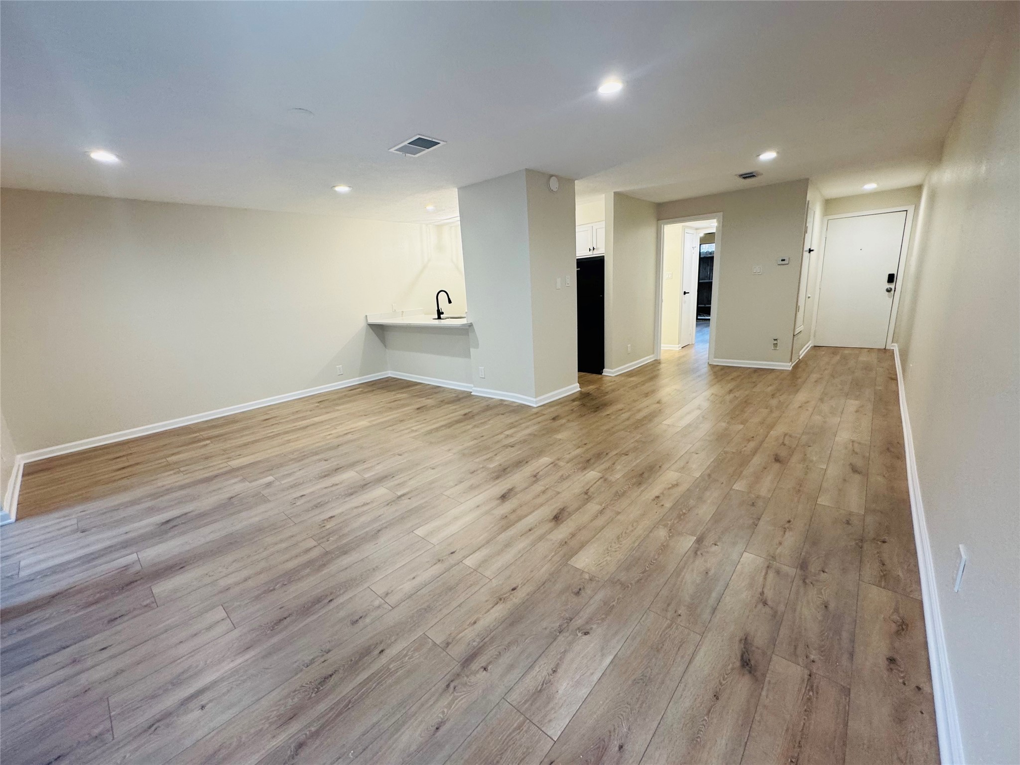3900 Aspen Drive, Unit C104 Montgomery, TX 77356 - Photo 13 of 21 a view of an empty room with wooden floor