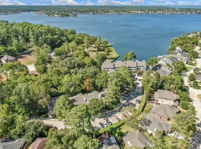 an aerial view of ocean with residential house with outdoor space