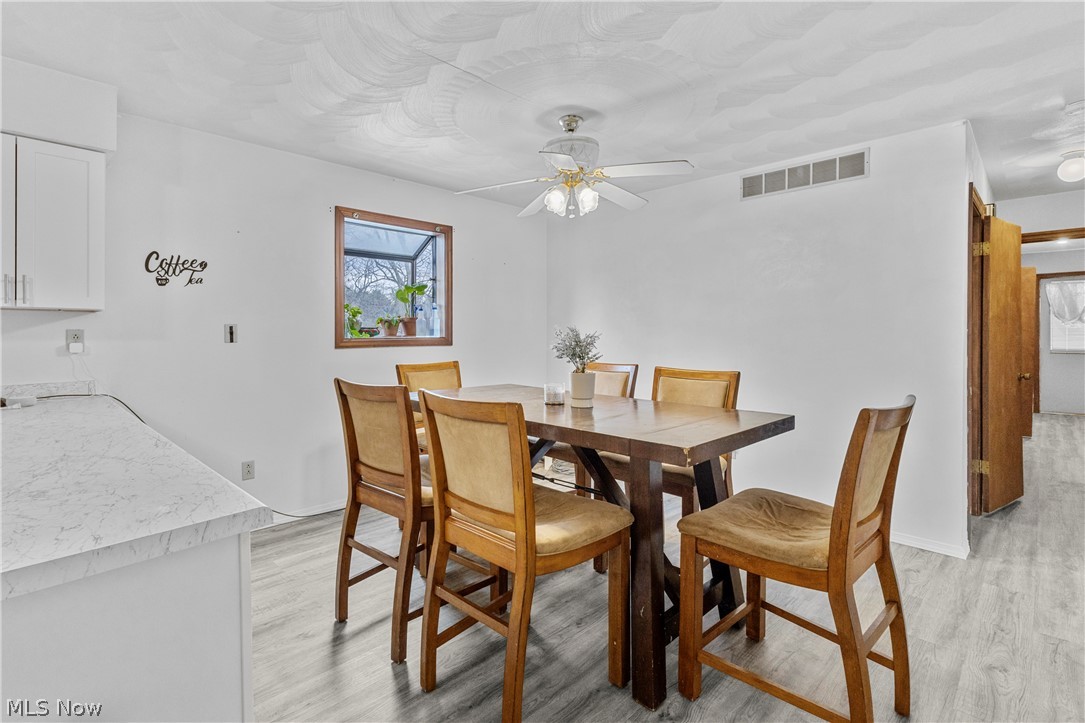 140 Iris Lane Colliers, WV 26035 - Photo 26 of 47 Dining space with ceiling fan and light hardwood / wood-style flooring