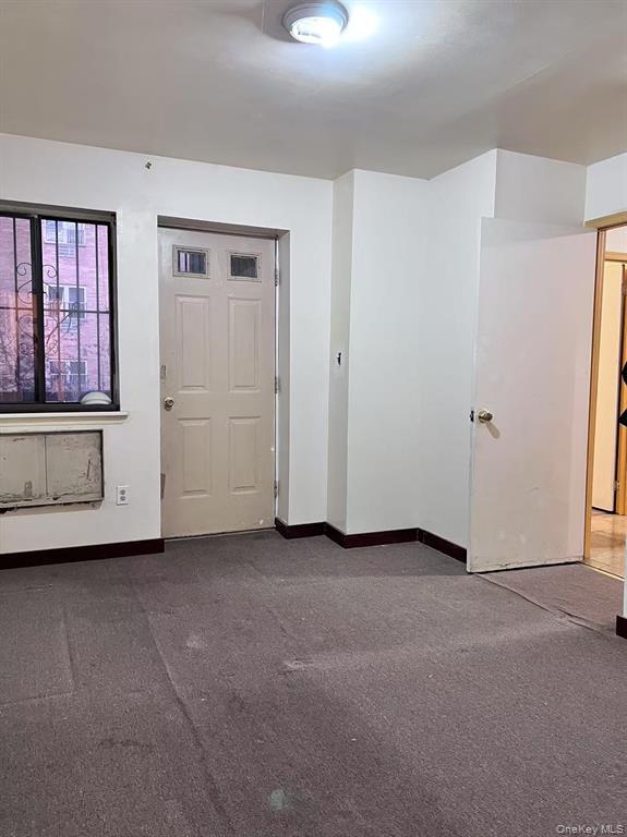 37-30 103rd Street, Unit 2B Queens, NY 11368 - Photo 5 of 8 an empty room with windows