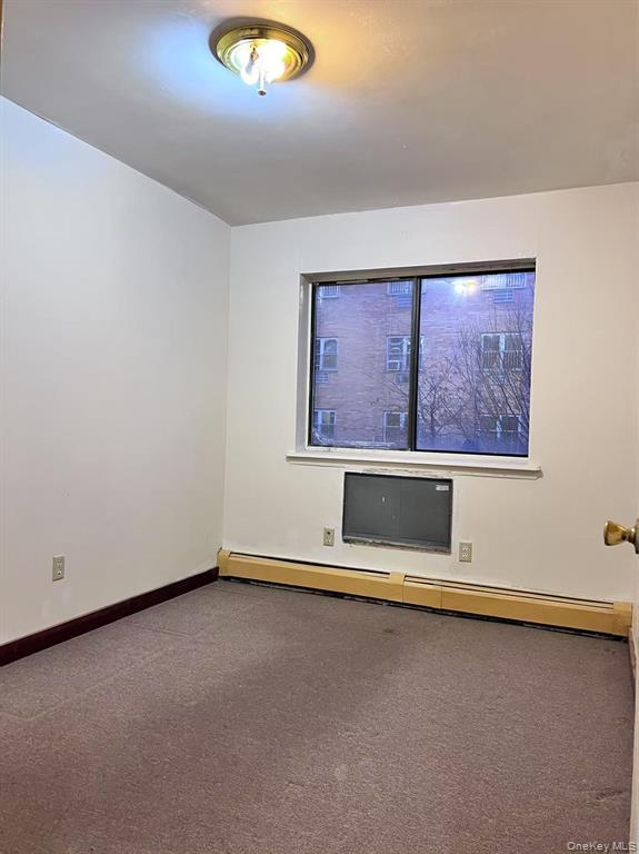 37-30 103rd Street, Unit 2B Queens, NY 11368 - Photo 6 of 8 an empty room with windows