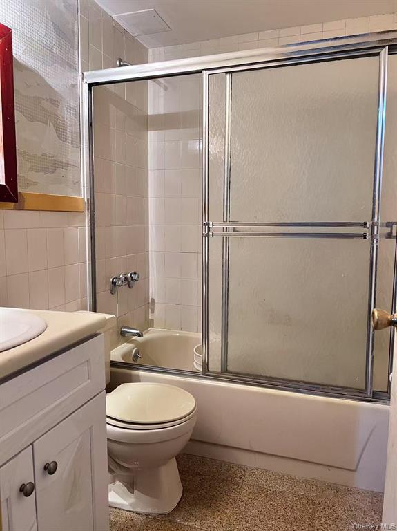 37-30 103rd Street, Unit 2B Queens, NY 11368 - Photo 8 of 8 a bathroom with a toilet a sink and a shower