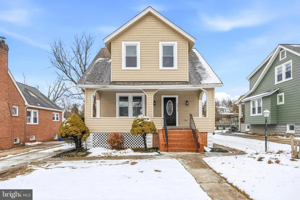 a view of a house with snow on the road