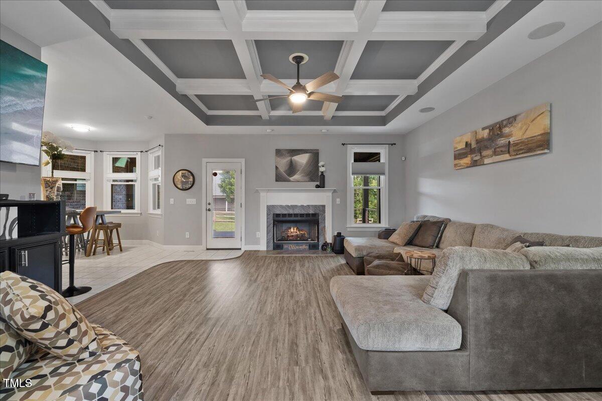 1005 Bellewood Farms Road Raleigh, NC 27603 - Photo 23 of 61 a living room with furniture and a fireplace