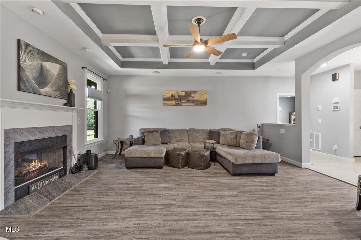 1005 Bellewood Farms Road Raleigh, NC 27603 - Photo 24 of 61 a living room with furniture and a fireplace