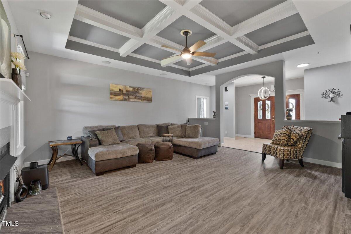 1005 Bellewood Farms Road Raleigh, NC 27603 - Photo 26 of 61 a living room with furniture and wooden floor