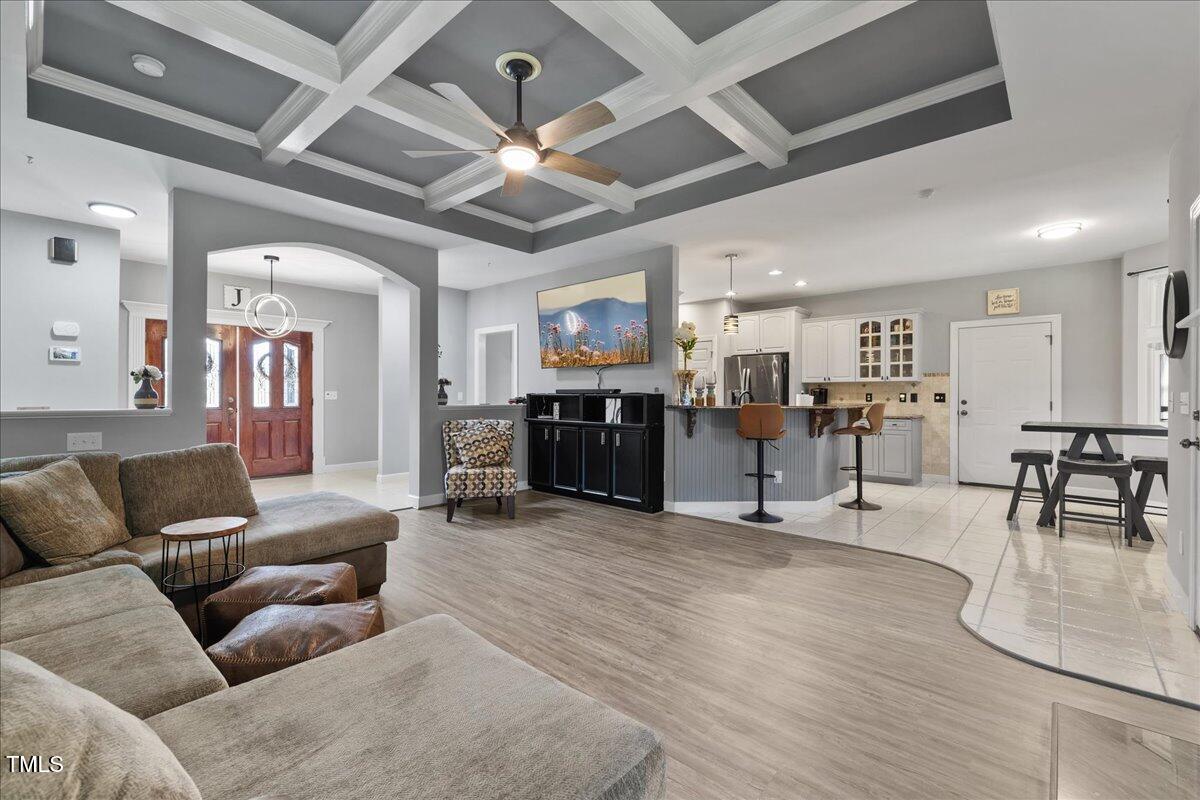 1005 Bellewood Farms Road Raleigh, NC 27603 - Photo 27 of 61 a living room with furniture and kitchen view