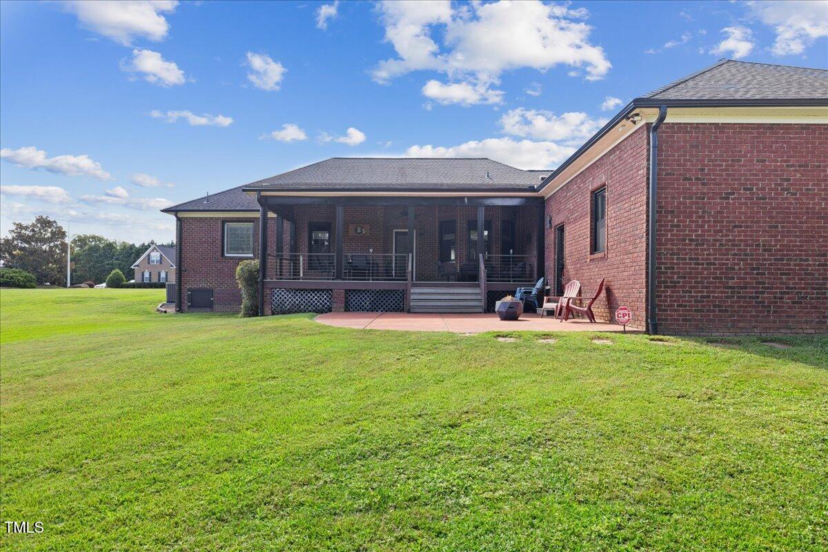 1005 Bellewood Farms Road Raleigh, NC 27603 - Photo 54 of 61 a view of a house with backyard and porch