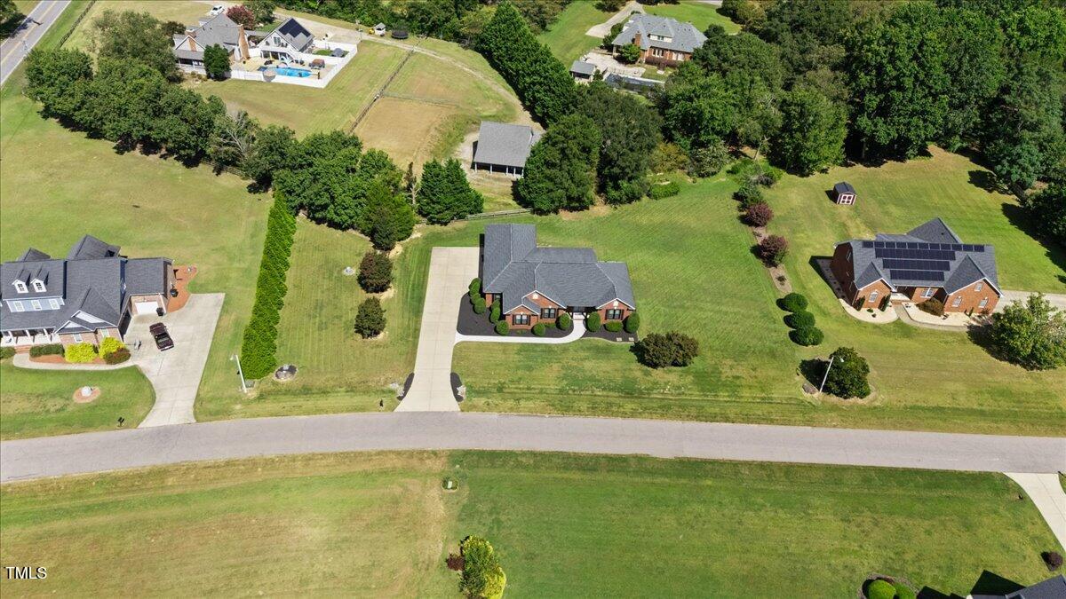 1005 Bellewood Farms Road Raleigh, NC 27603 - Photo 58 of 61 an aerial view of a house with a swimming pool yard and outdoor seating
