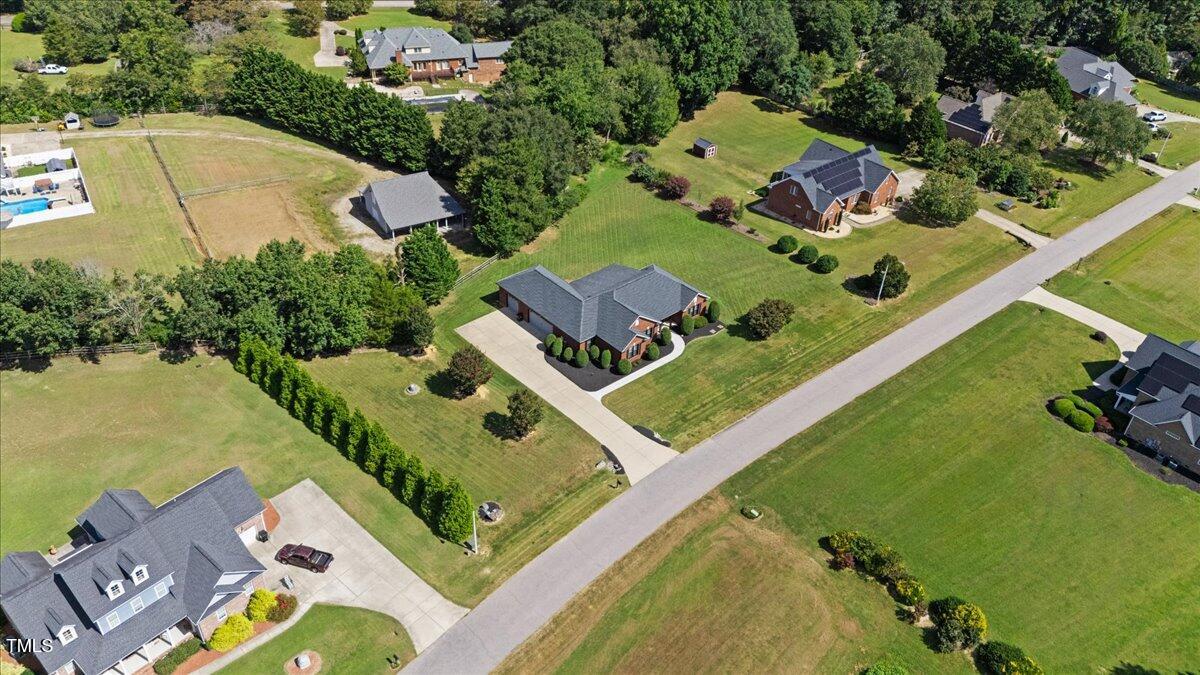 1005 Bellewood Farms Road Raleigh, NC 27603 - Photo 59 of 61 an aerial view of a house with a garden and lake view
