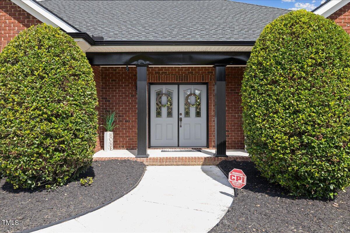 1005 Bellewood Farms Road Raleigh, NC 27603 - Photo 8 of 61 a front view of a house with a garage