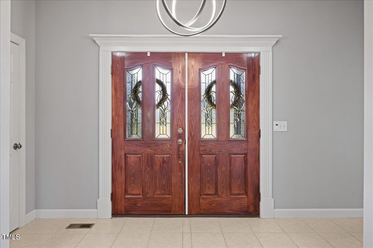 1005 Bellewood Farms Road Raleigh, NC 27603 - Photo 10 of 61 a front view of a house with entryway