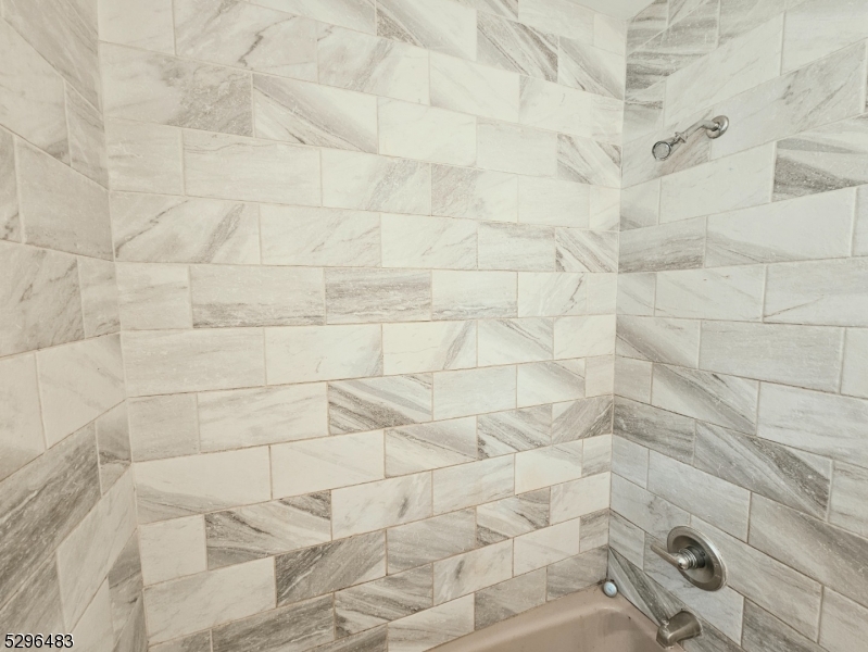 201 Vail Street, Unit 1B Hackettstown, NJ 07840 - Photo 10 of 12 a bathroom with a shower