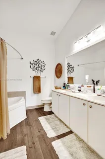 a living room with a sink and a stove