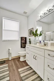 a bathroom with a glass shower door
