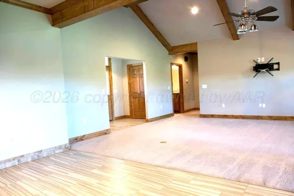 a view of a room with a wooden floor