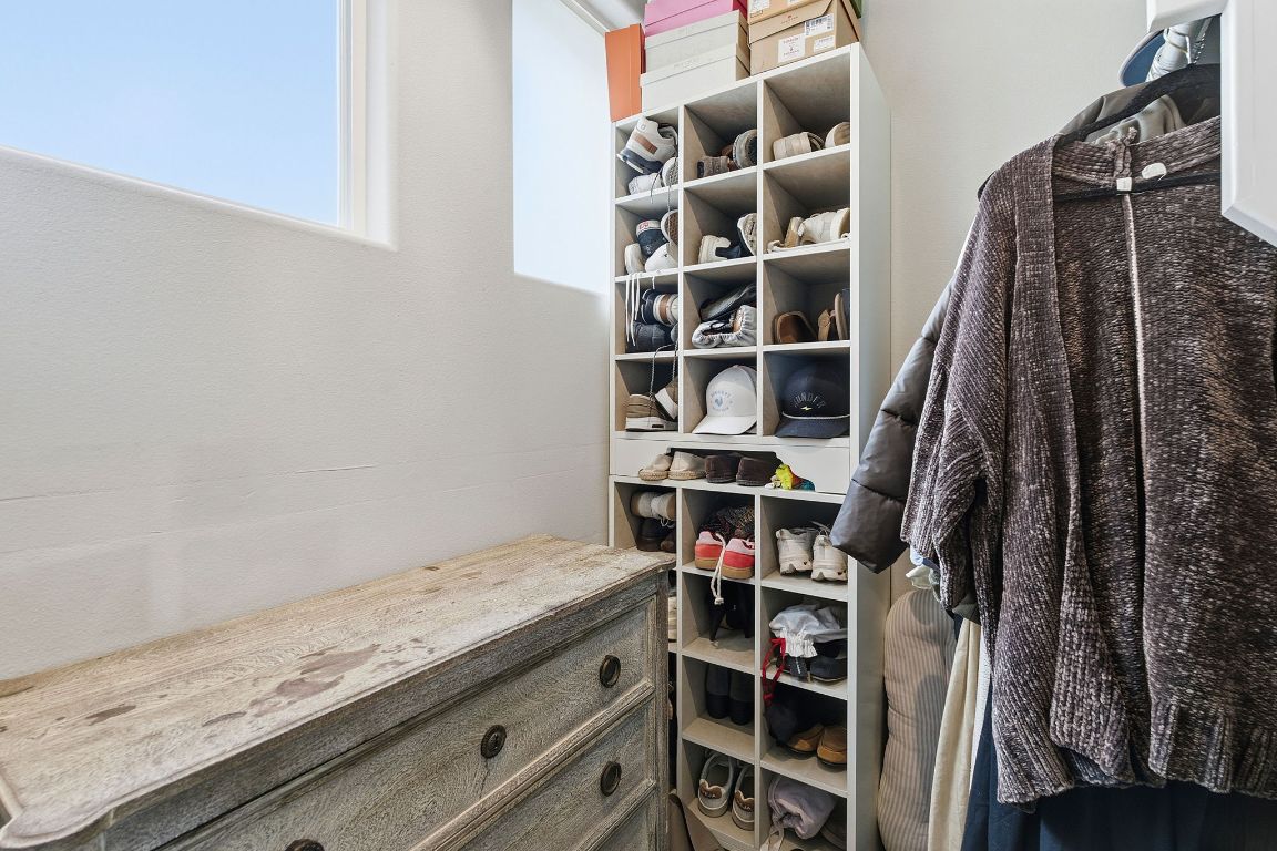 10012 Janet Loop Dripping Springs, TX 78620 - Photo 19 of 38 a view of walk in closet with empty racks