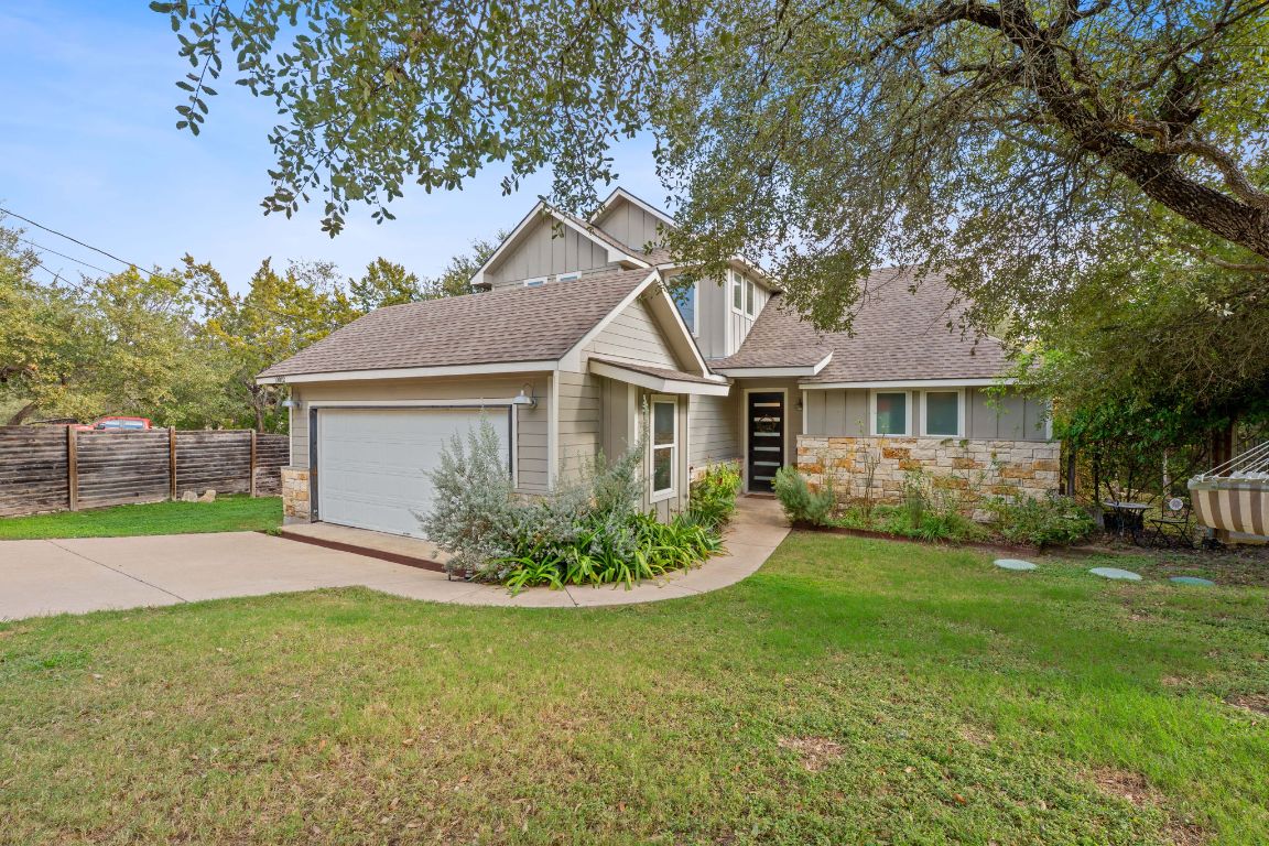 10012 Janet Loop Dripping Springs, TX 78620 - Photo 2 of 38 a view of a house with a backyard