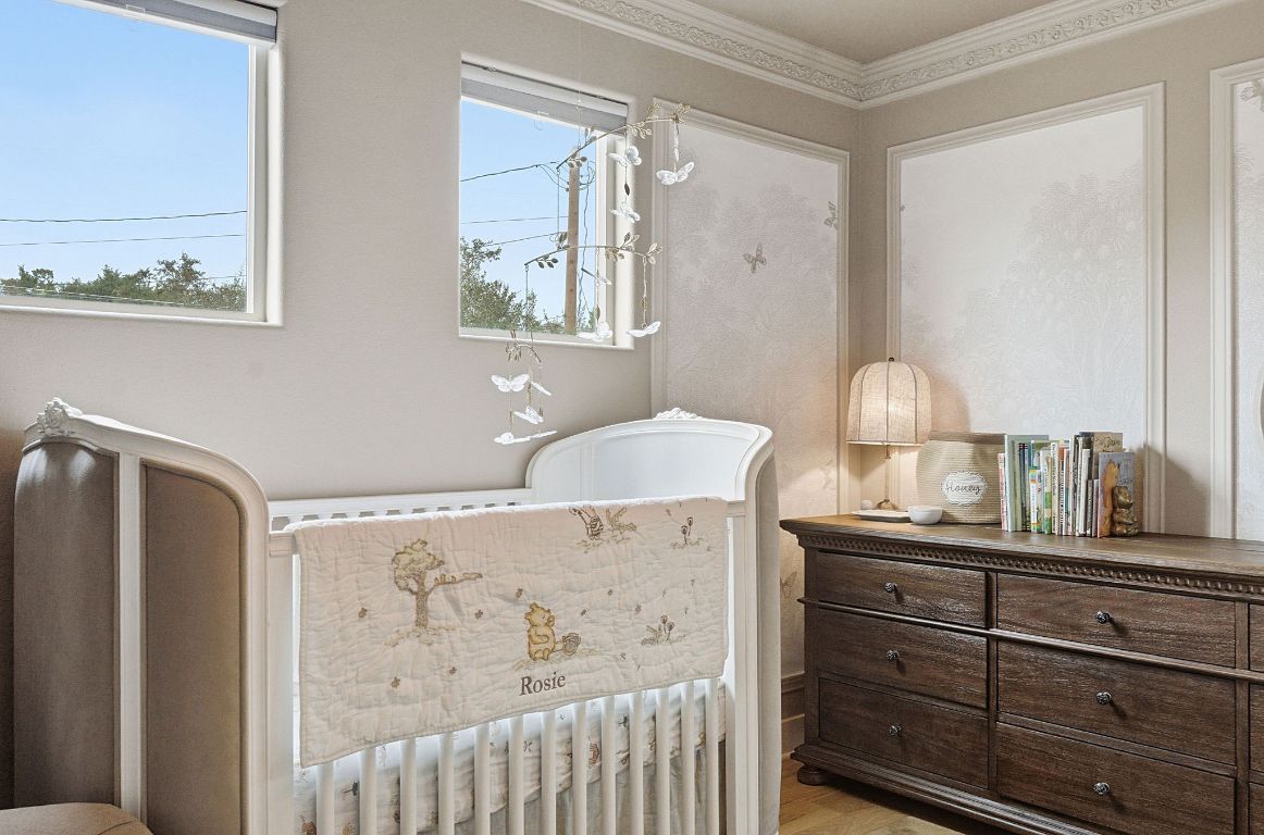 10012 Janet Loop Dripping Springs, TX 78620 - Photo 21 of 38 a room with a bed and a dresser