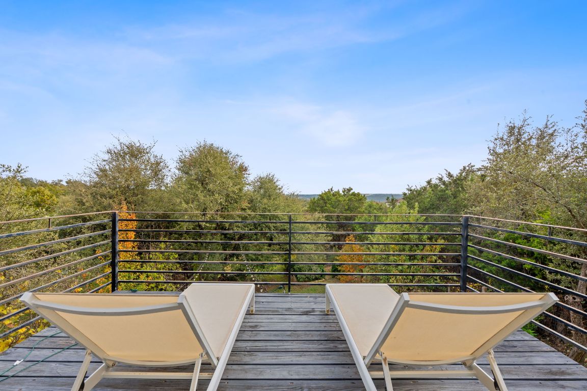 10012 Janet Loop Dripping Springs, TX 78620 - Photo 23 of 38 a view of a chairs and table on the terrace