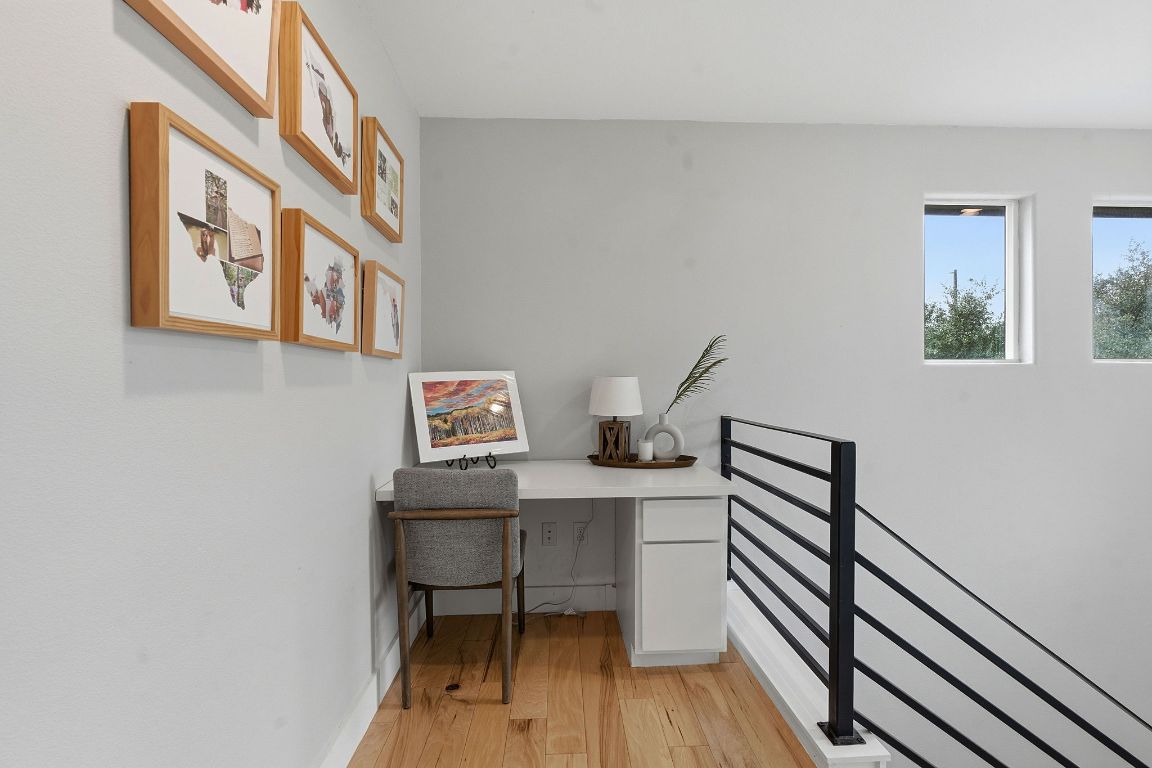 10012 Janet Loop Dripping Springs, TX 78620 - Photo 24 of 38 a view of a workspace with furniture and wooden floor