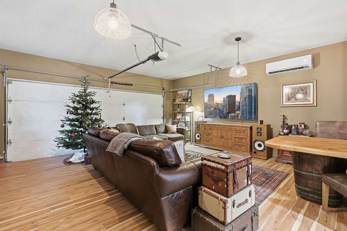 10012 Janet Loop Dripping Springs, TX 78620 - Photo 26 of 38 a living room with furniture a window and a wooden floor