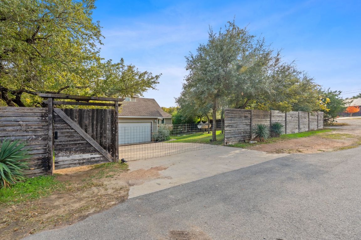 10012 Janet Loop Dripping Springs, TX 78620 - Photo 37 of 38 a view of a house with wooden fence