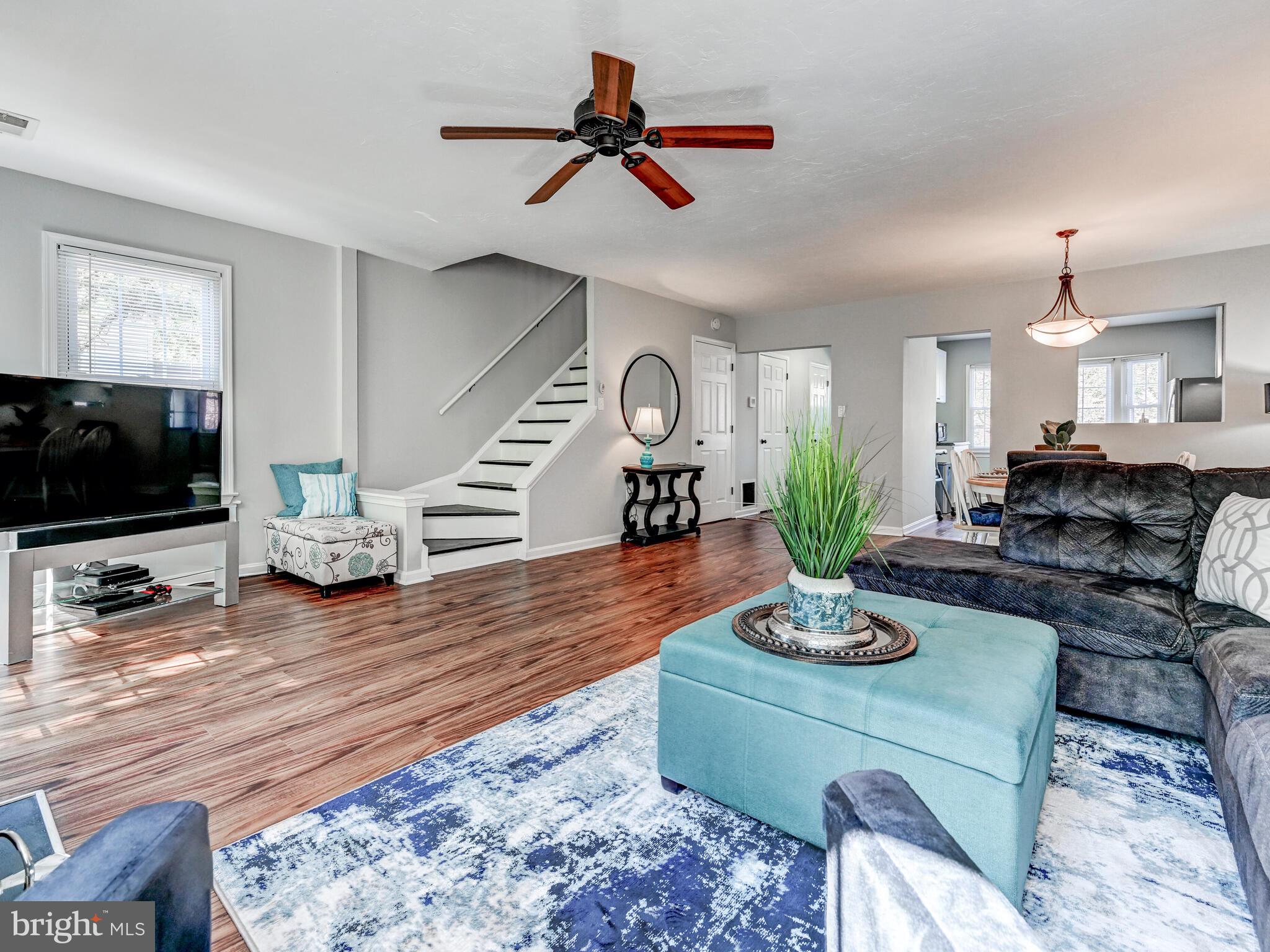 1679 Hart Court Crofton, MD 21114 - Photo 13 of 38 a living room with furniture flat screen tv and wooden floor