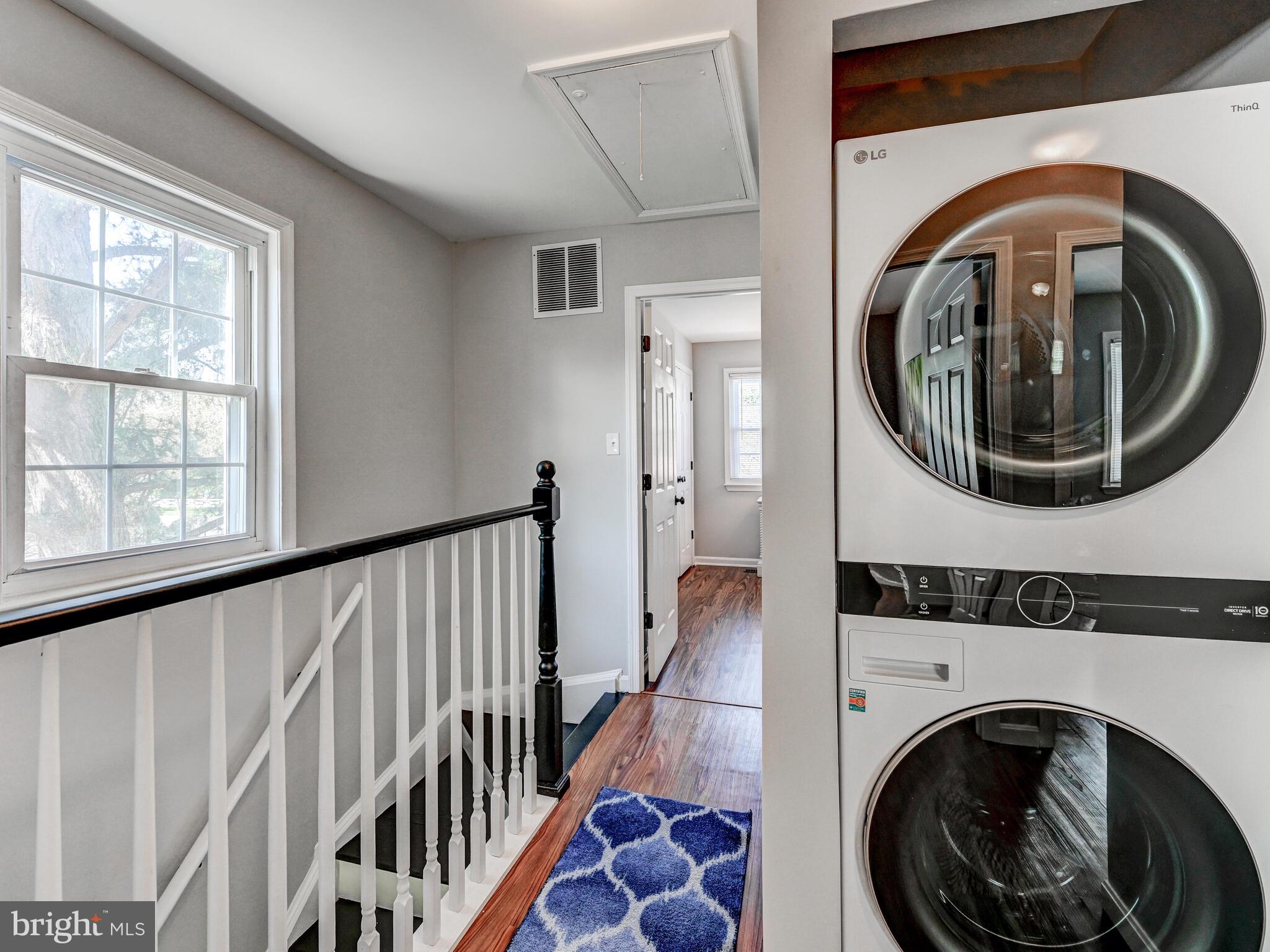 1679 Hart Court Crofton, MD 21114 - Photo 22 of 38 a view of a hallway with washer and dryer