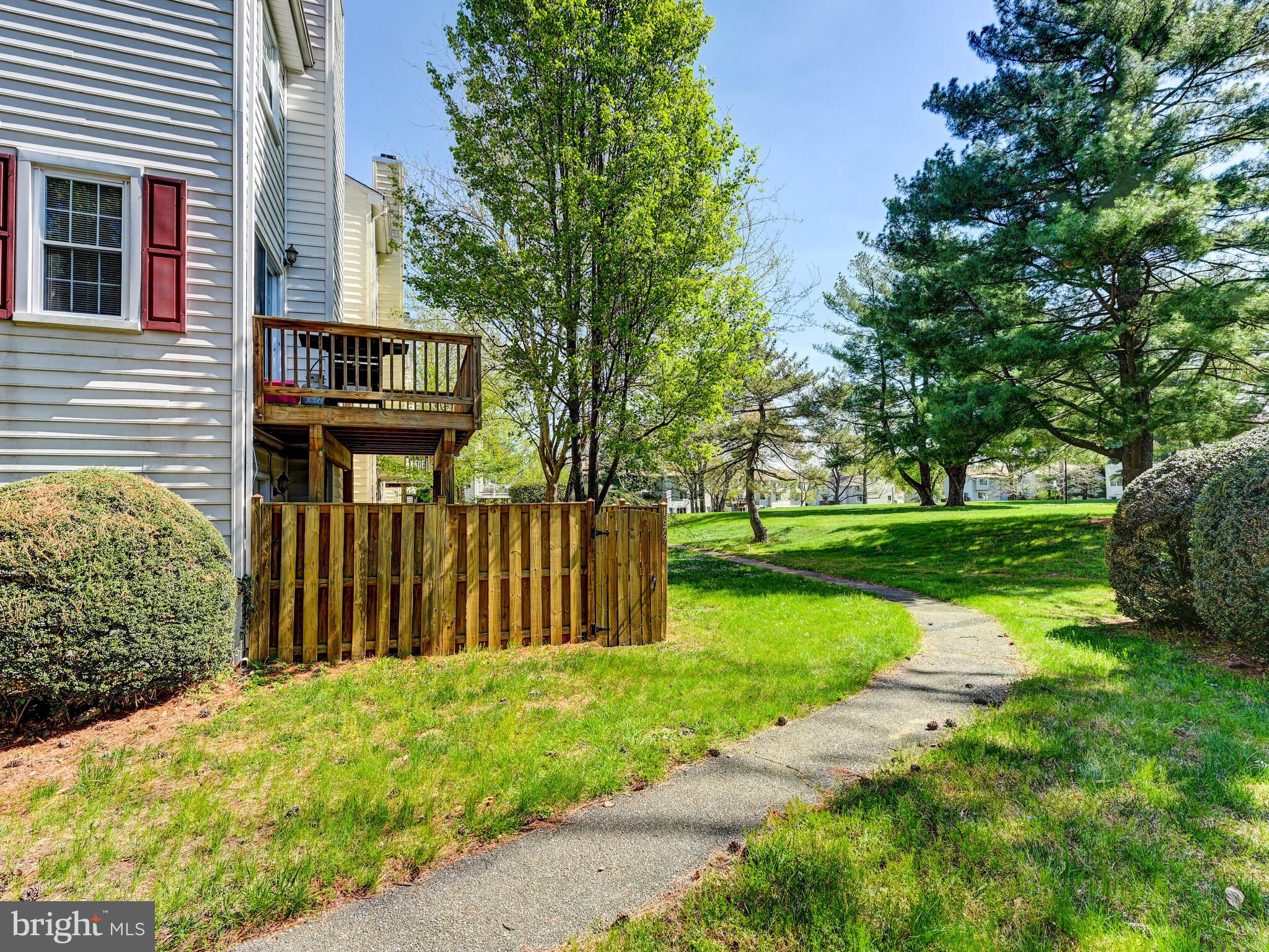 1679 Hart Court Crofton, MD 21114 - Photo 24 of 38 a view of a park with pathway and a yard