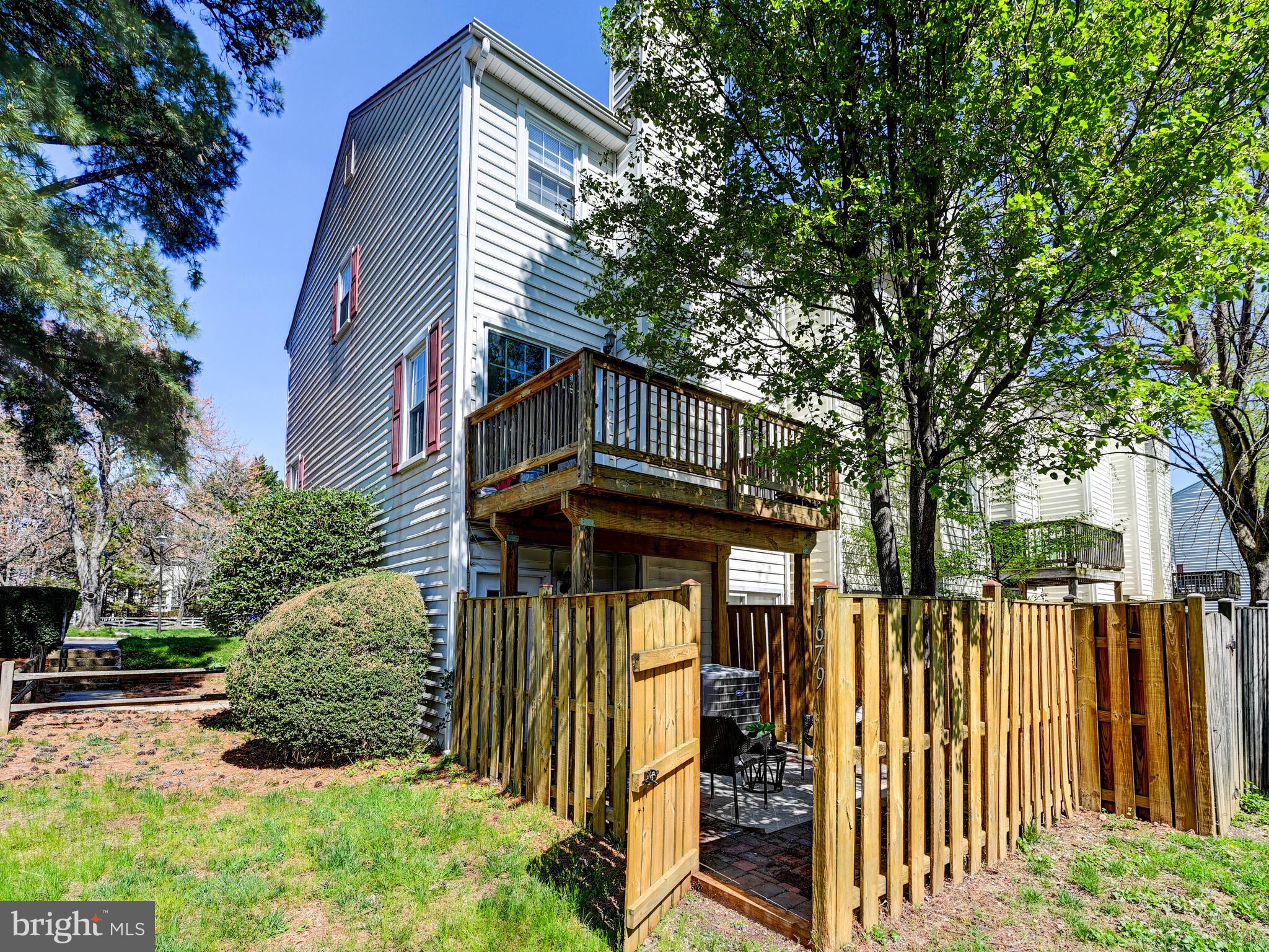 1679 Hart Court Crofton, MD 21114 - Photo 26 of 38 a view of a house with wooden fence