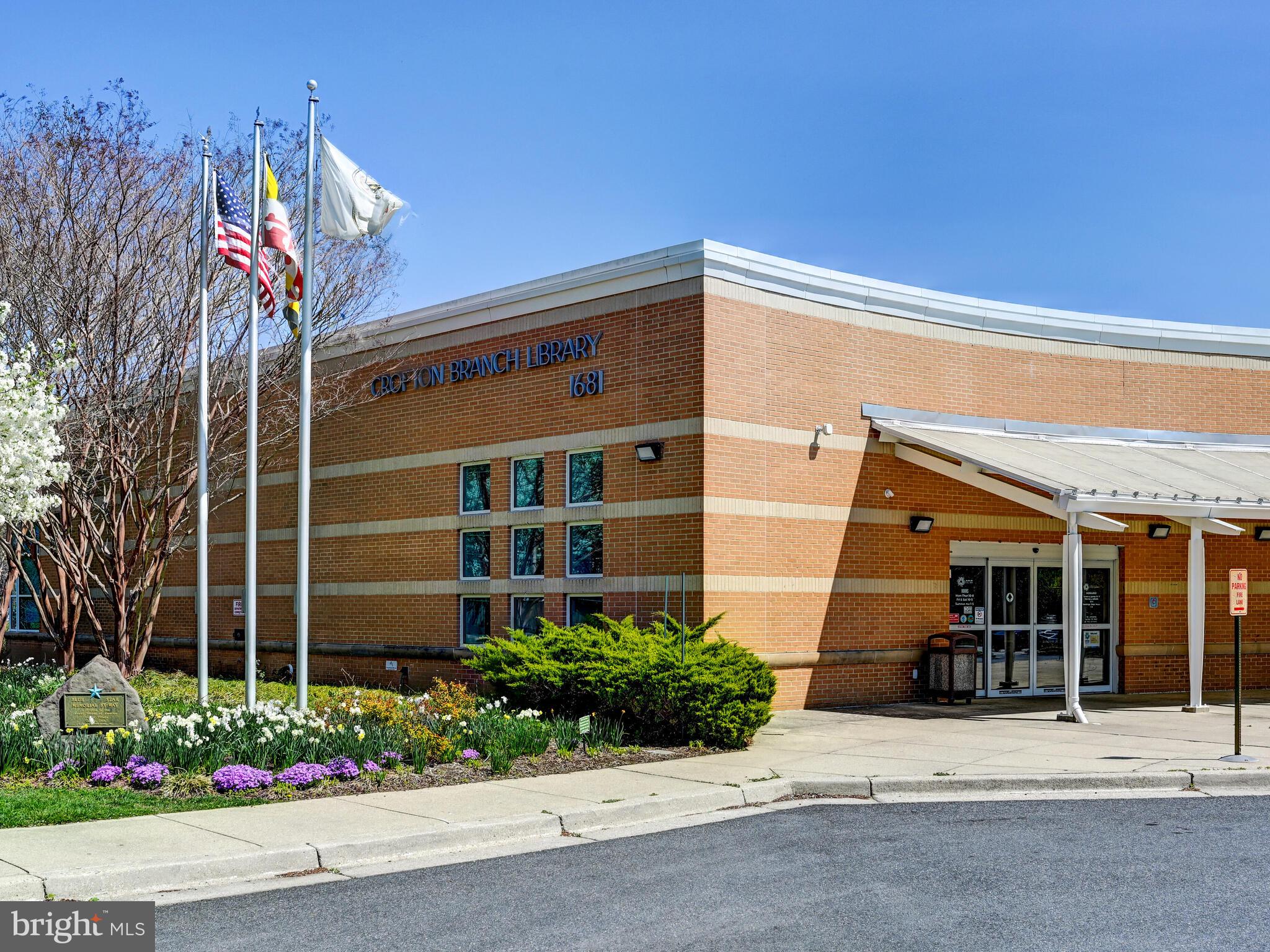 1679 Hart Court Crofton, MD 21114 - Photo 34 of 38 a front view of a house with a garden and plants