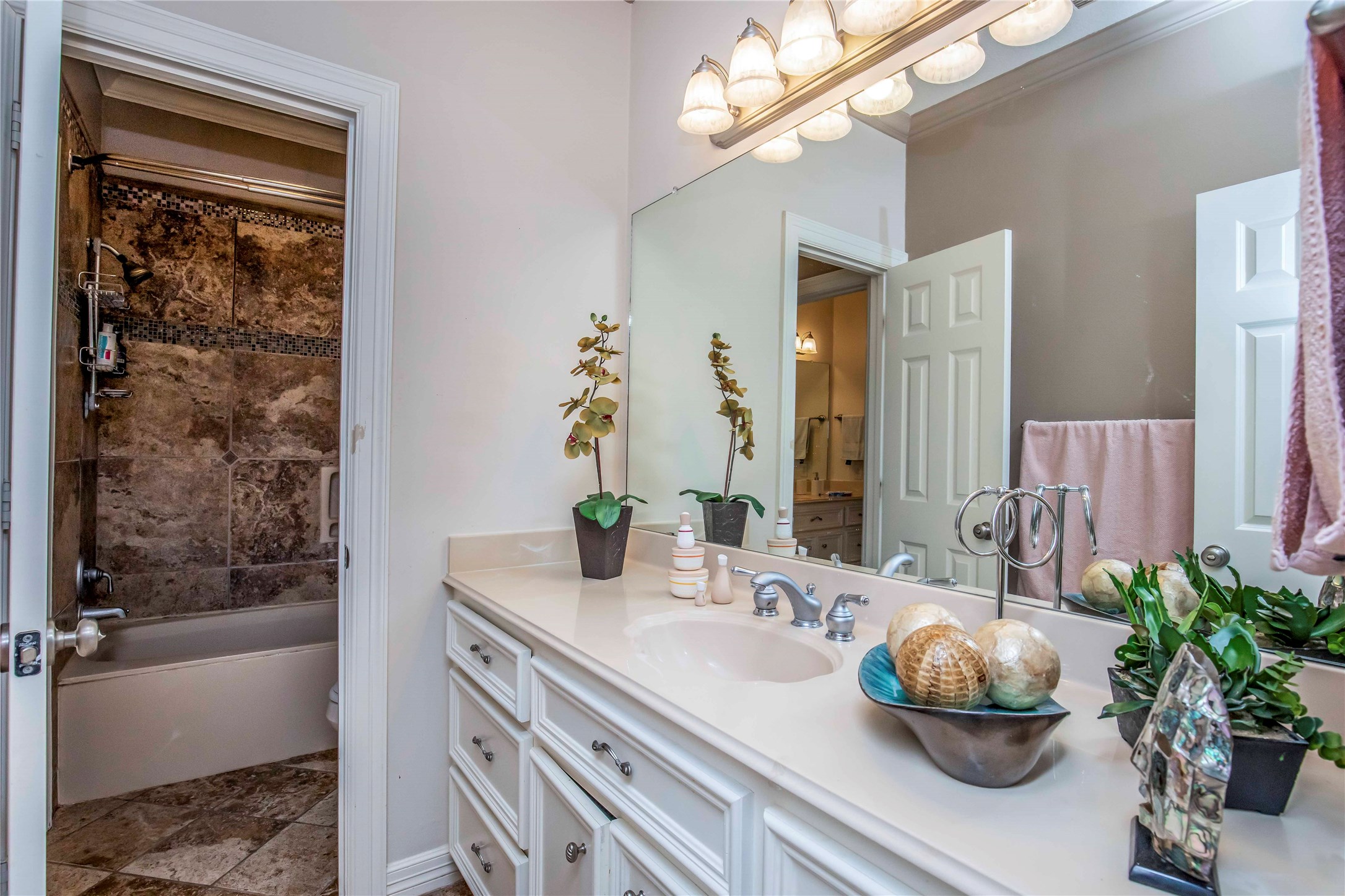 25219 Hideaway Run Drive Spring, TX 77389 - Photo 39 of 45 a bathroom with a granite countertop sink a large mirror and a bathtub