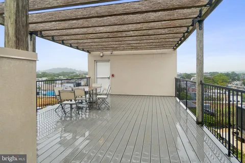 a view of a patio with wooden floor